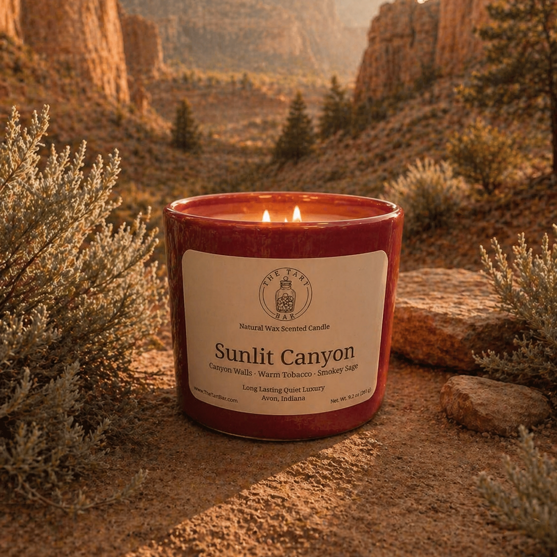 Candle labeled 'Sunlit Canyon' in a desert landscape with rocky formations and sparse vegetation.