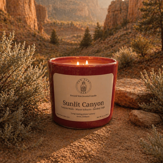 Candle labeled 'Sunlit Canyon' in a desert landscape with rocky formations and sparse vegetation.
